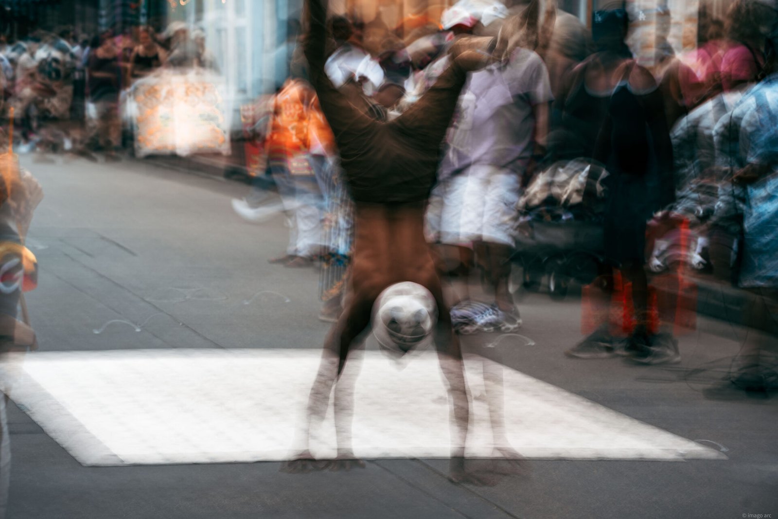 Breakdancer mid-move, captured with slow shutter to convey motion, Buenos Aires, Argentina