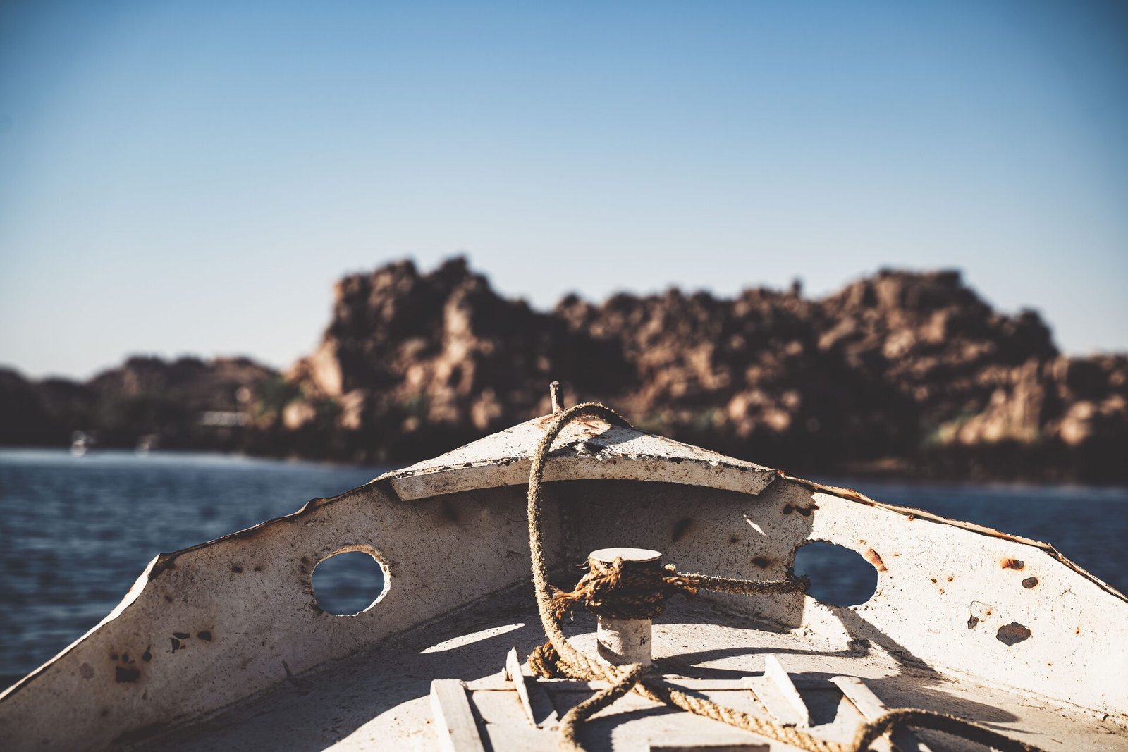 Traditional wooden boat prow on the Nile River, warm desert light, Egypt